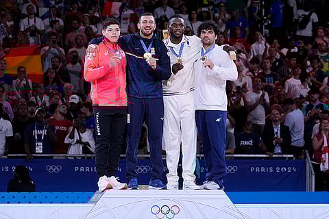 Medal ceremony for men's -90kg event in team judo competition